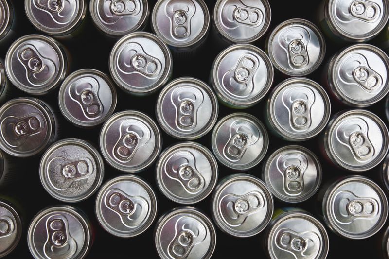Assorted craft soda cans on ice
