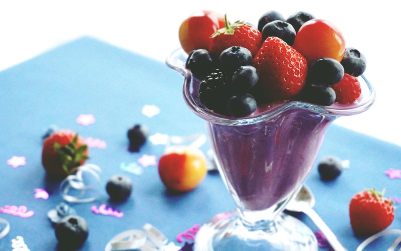 Fresh fruit smoothie with berries and mango