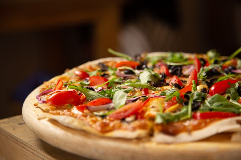Garden Veggie pizza with colorful bell peppers and olives